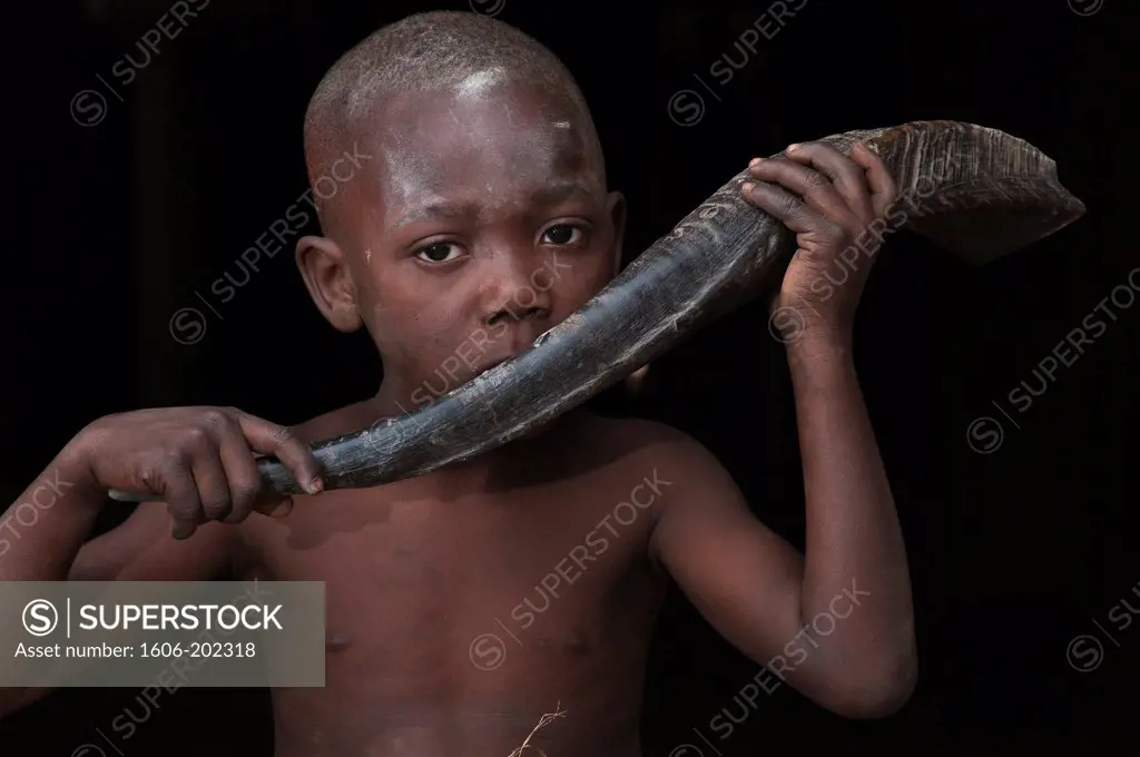 Africa, Gabon, Estuaire Region, Tsango Island, Bwiti Ceremonies, The Young Man Ernat Soumouna Blowing In A Buffalo Horn