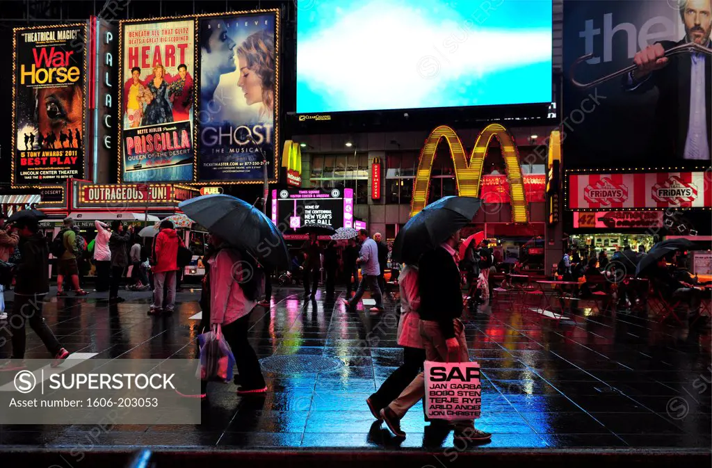 People Walking Up Broadway In Times Square At Night  In New York City, New York State, United State, Usa