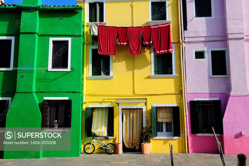 Colorful Houses With Hanging Laundry In The Island Of Burano Near Venice, Italy, Europe