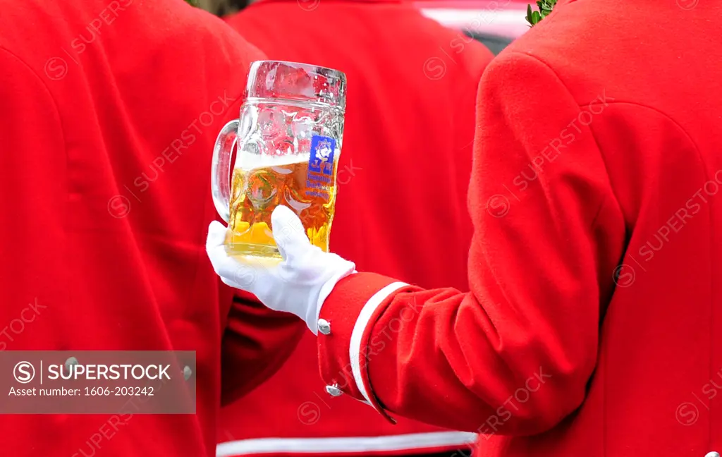 Member Of A Typical Bavarians Drum Band With Glass Of Beer  On Oktoberfest Parade In Munich, Germany