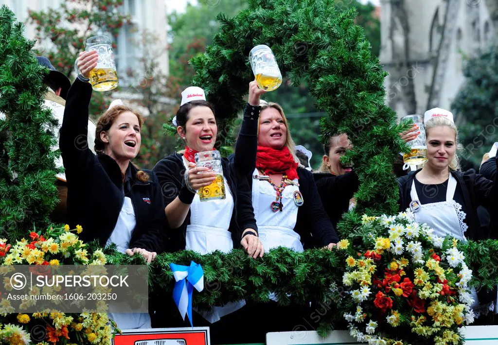 People Celebrate And Drink Beer During The Opening Day Of The Oktoberfest In Munich, Germany