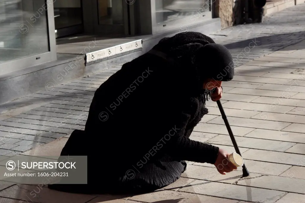 FRANCE, Old woman begging in the street