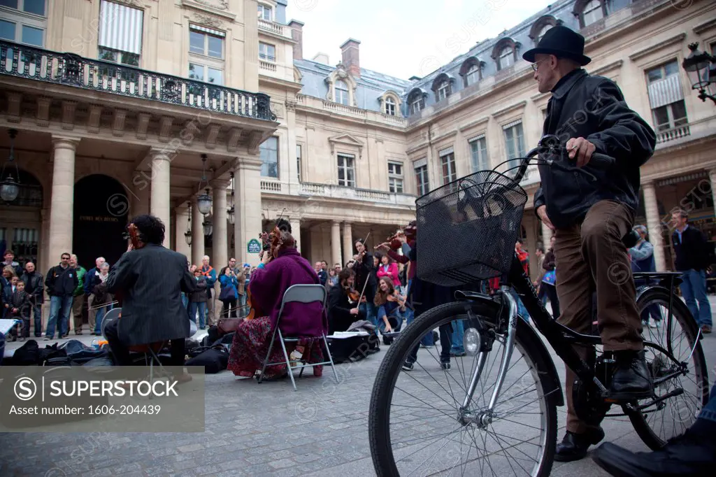France. Paris 1st district. Place du Palais Royal (Royal Palace square), classical music band playing in the street
