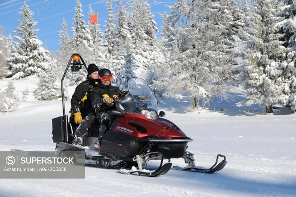 Northeastern France, Vosges Department, Ski Pattrolers riding a snowmobile