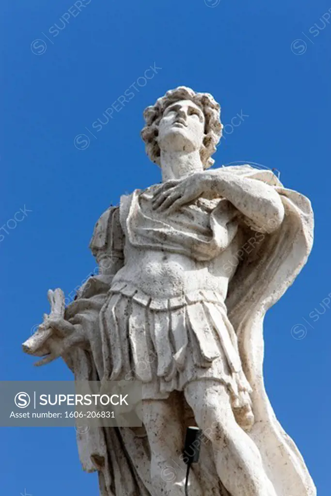 Italy. Rome. The Vatican. St. Peter's Square. Focus on the statue of a saint above the colonnades.