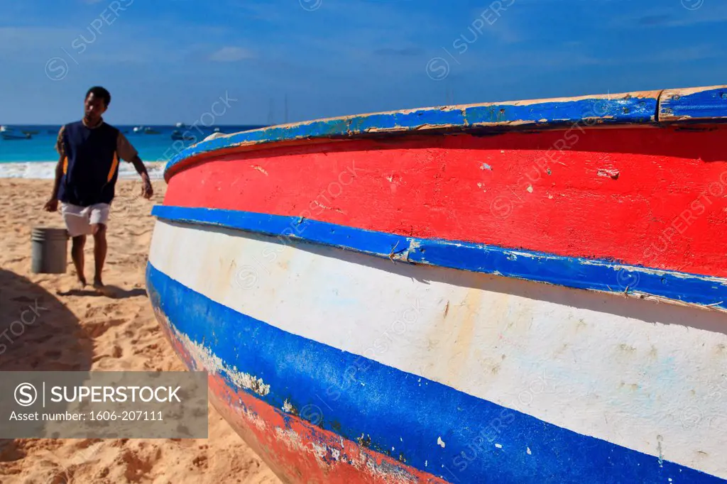 Western Africa,Republic of Cape Verde, Sal island. Santa Maria. Fisherman and boat on the beach.