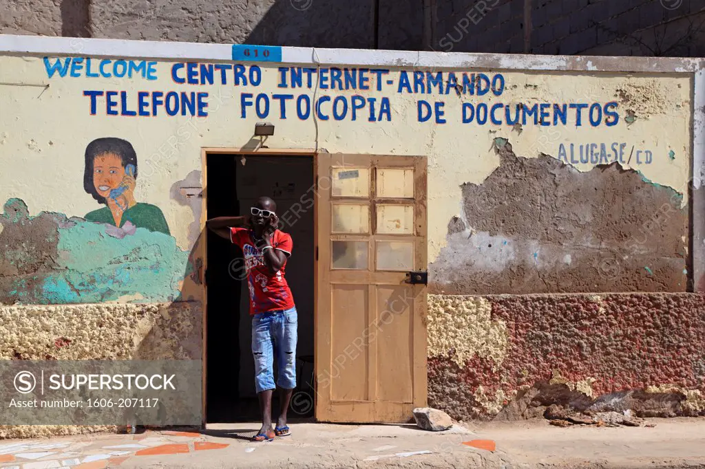 Western Africa,Republic of Cape Verde, Sal island. Santa Maria. Man with a phone.