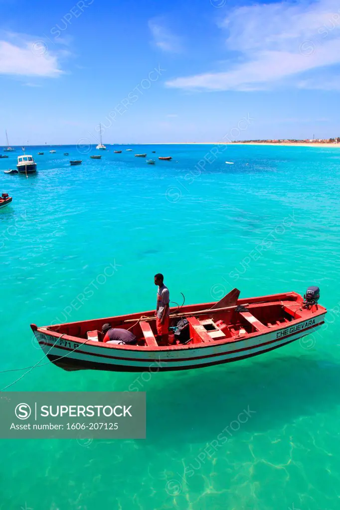 Western Africa,Republic of Cape Verde, Sal island. Santa Maria. Fishermen on a red boat.