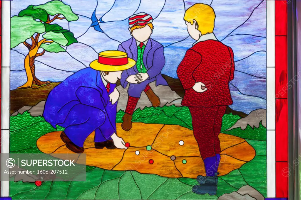 England,Devon,Bovey Tracey,House of Marbles Pottery Museum and Teign Valley Glassworks,Stained Glass Window depicting People Playing Marbles