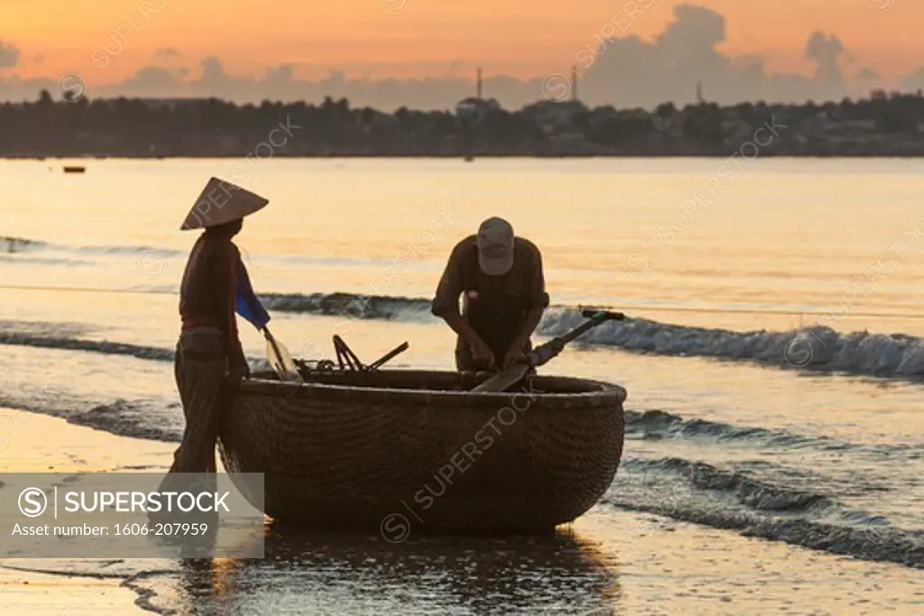 Vietnam,Mui Ne,Mui Ne Beach,Net Fisherwoman at Dawn