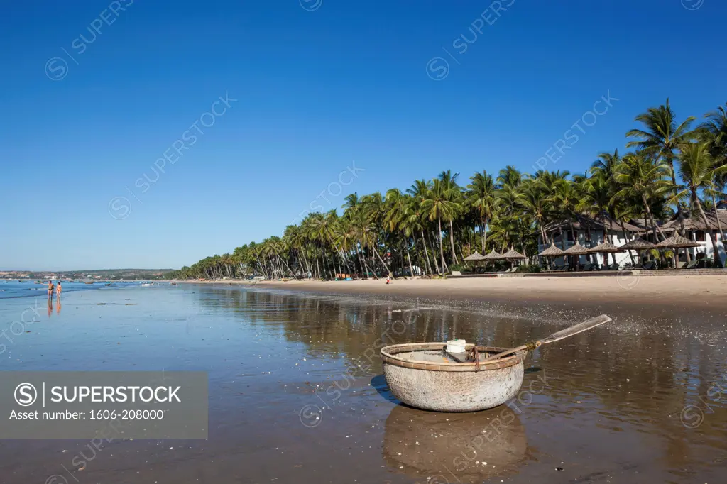 Vietnam,Mui Ne,Mui Ne Beach,Coracle Fishing Boat and Palm Trees