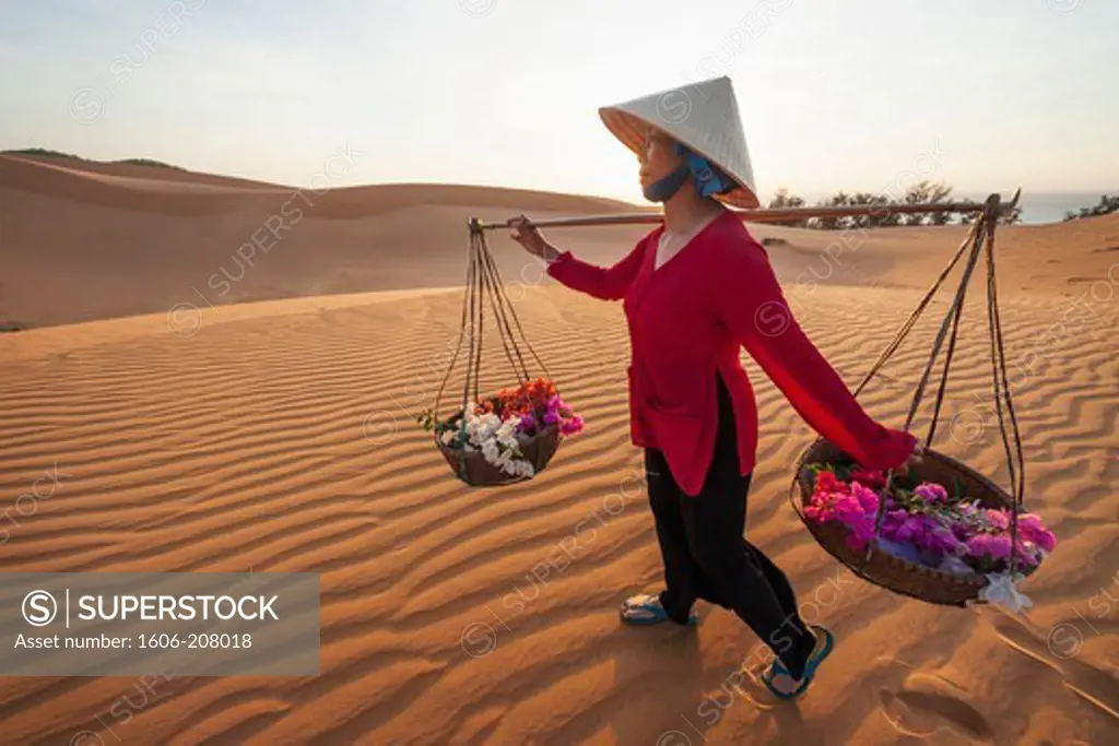 Vietnam,Mui Ne,Sand Dunes and Local Woman in Conical Hat