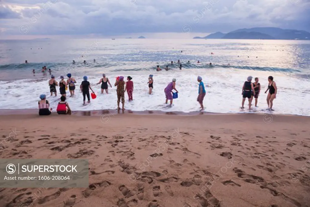 Vietnam,Nha Trang,Nha Trang Beach,Locals Swimming at Dawn