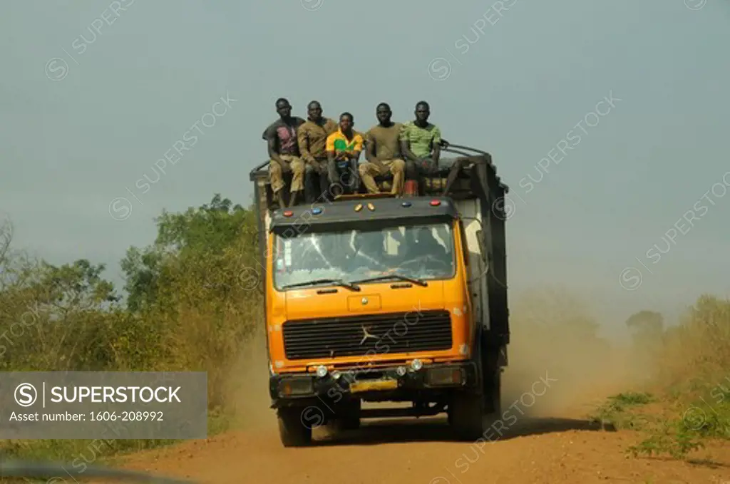 TOGO a group of men is travelling on the roof of a truck