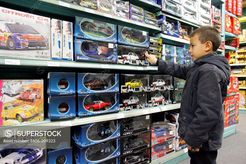 7-year-old boy in a toy shop Paris. France.