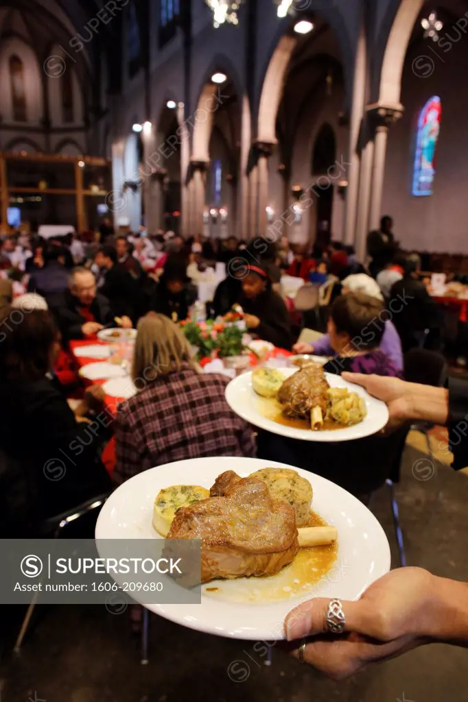 Christmas meal offered by the SantÕEgidio community in Saint-Hippolyte church, Paris France.