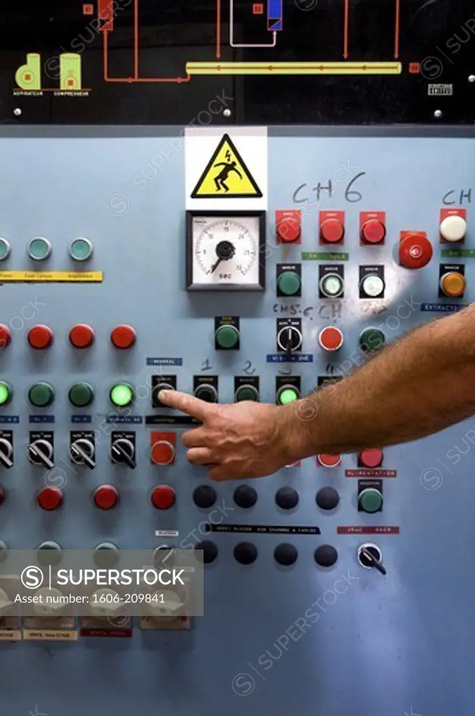 France, flour mill, a finger presses a button on a console
