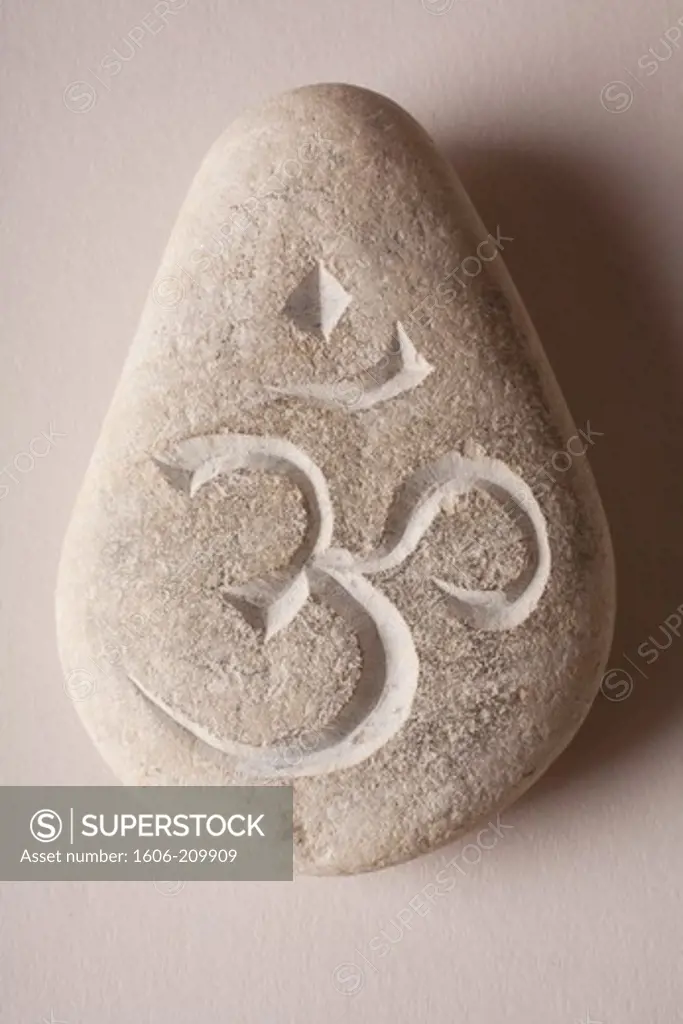Om engraved stone