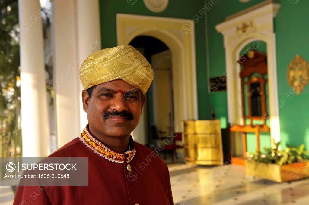 Belboy in his uniform at the entrance of  Lalitha Mahal Palace hotel in Mysore,the hotel was built in the year 1931 for special guests of the Maharajas ,Karnataka state,South India,Asia