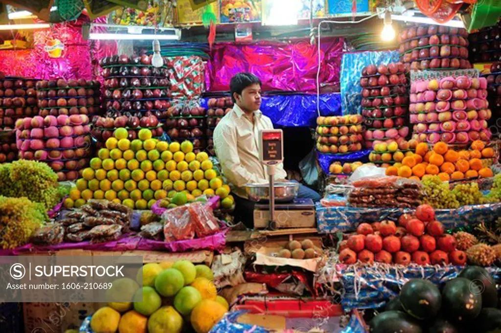 Indian man selling fruits in market of Mysore,Karnataka state,South India,Asia