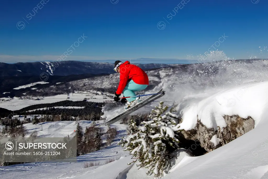 France,Vercors, skier jumping in powder snow, view on the Vercors.