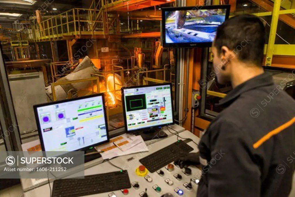 France, Centre, Dreux, Loiselet foundry, technician in front of screens controlling fusion crucible.