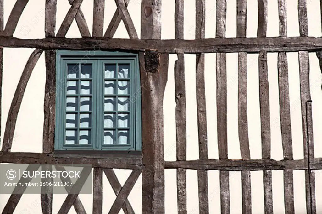 France, Upper Normandy, Rouen, traditional halt-timbered house façade with window.