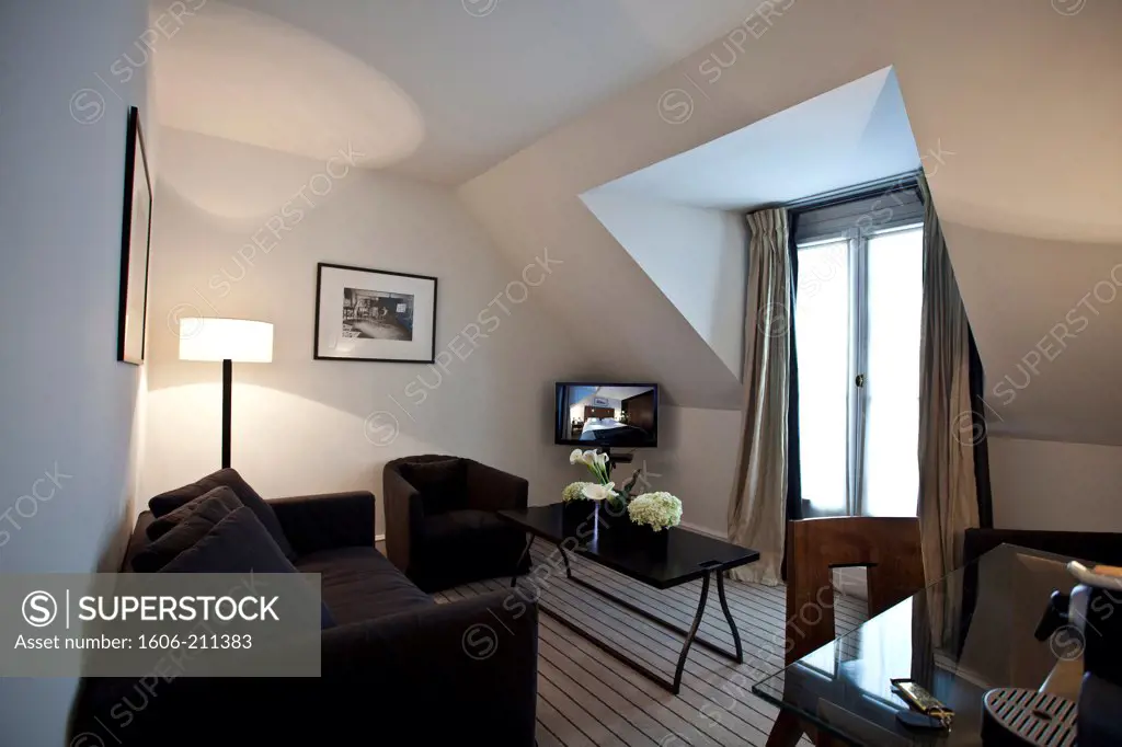France, Paris, Montalembert Hotel, hotel room, couch, TV, tables.