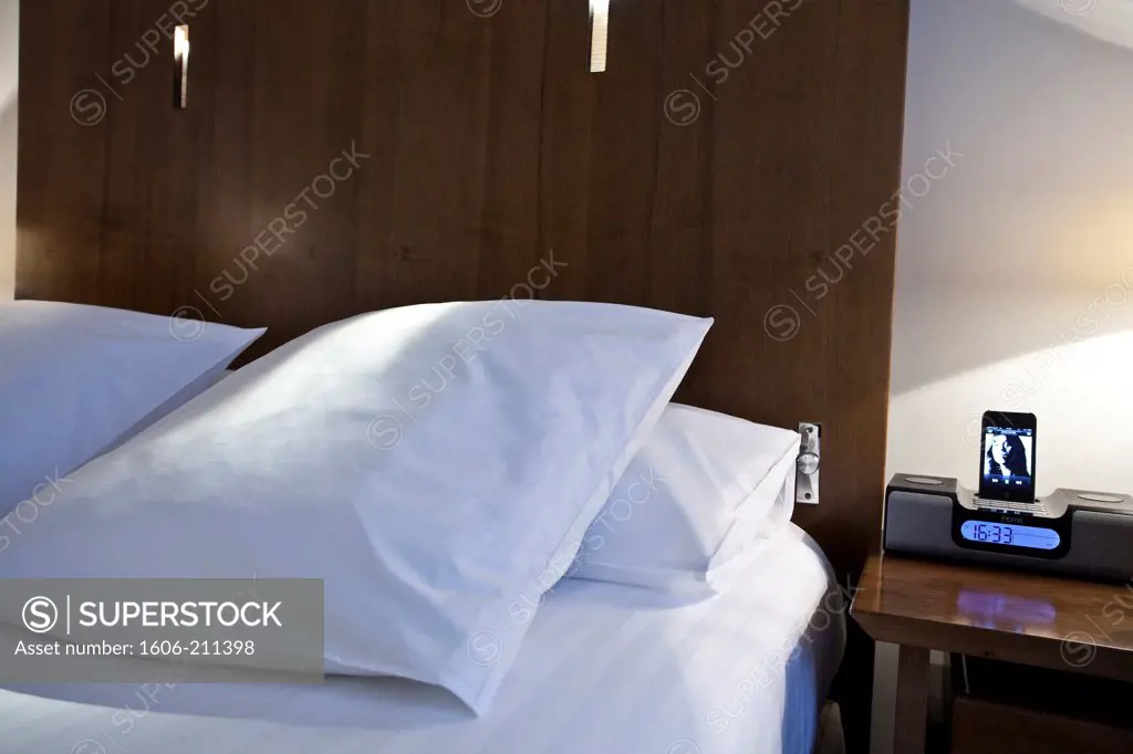 France, Paris, Montalembert Hotel, bed, bedside table, pillowcase, radio alarm.