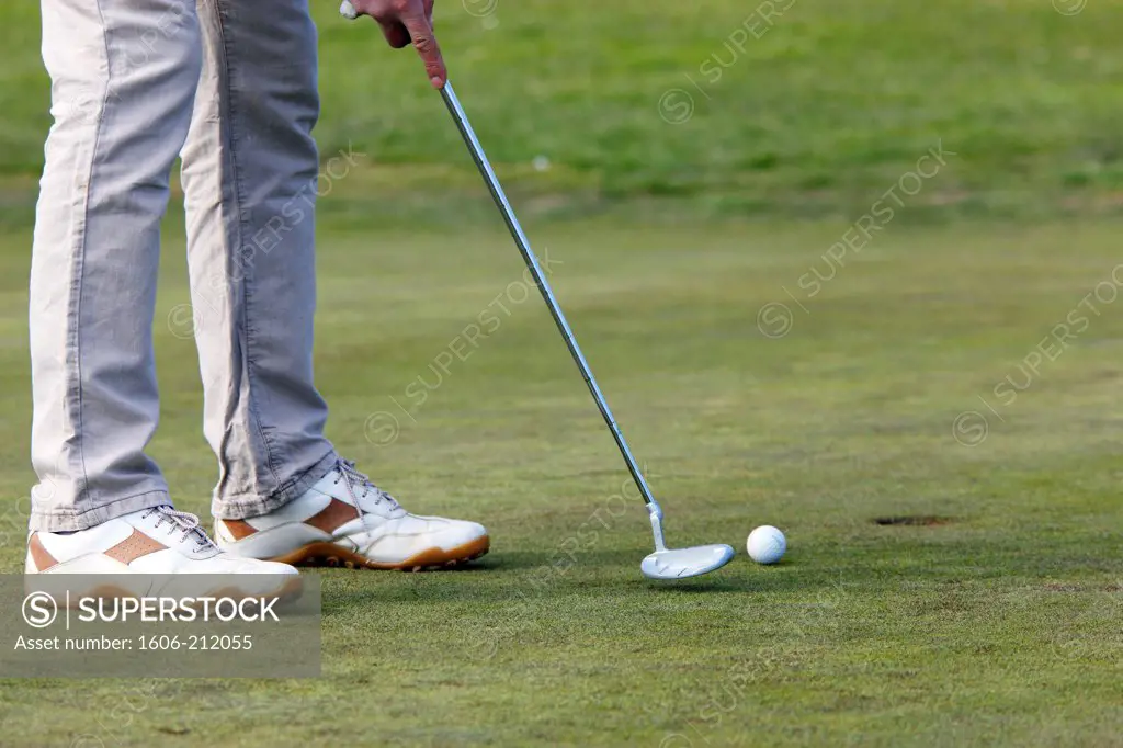 France, Crecy la Chapelle. Golf. close-up of a golfer's legs about to putt