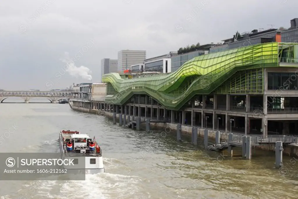FRANCE, Paris, the Seine with a barge along ""the docks"", the new  Cité de la mode et du Design building
