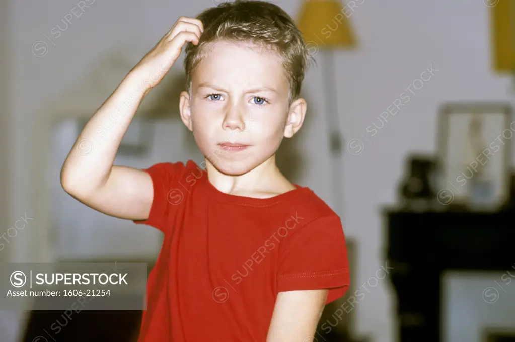Little boy straching himself, indoors