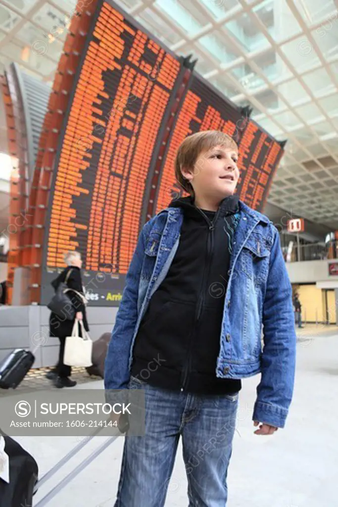 France,Paris,  CDG airport. Young boy with luggage.