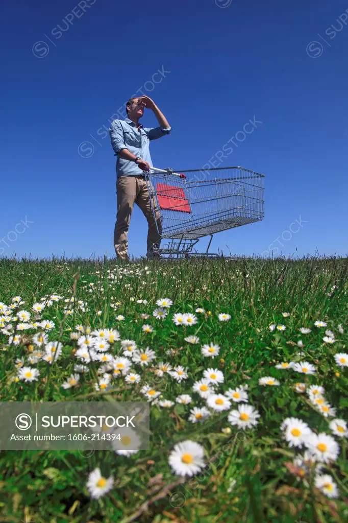 France, young man with shopping trolley