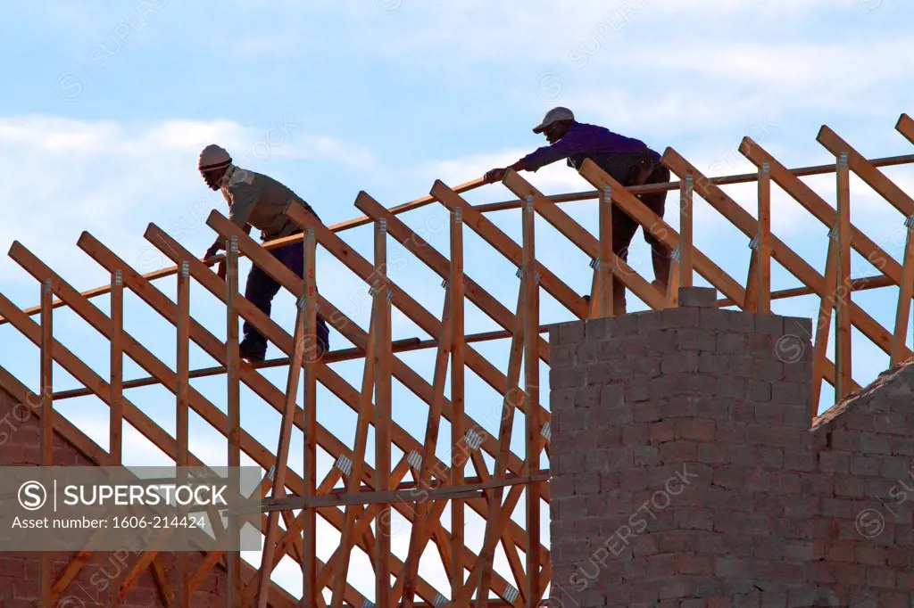 South Africa. Two men building a roof.