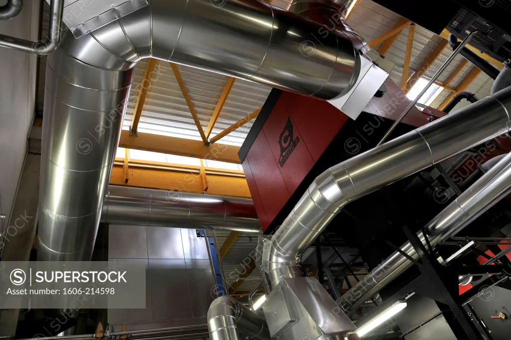 France, biomass boiler room supplied with wood waste for district heating in Nantes.