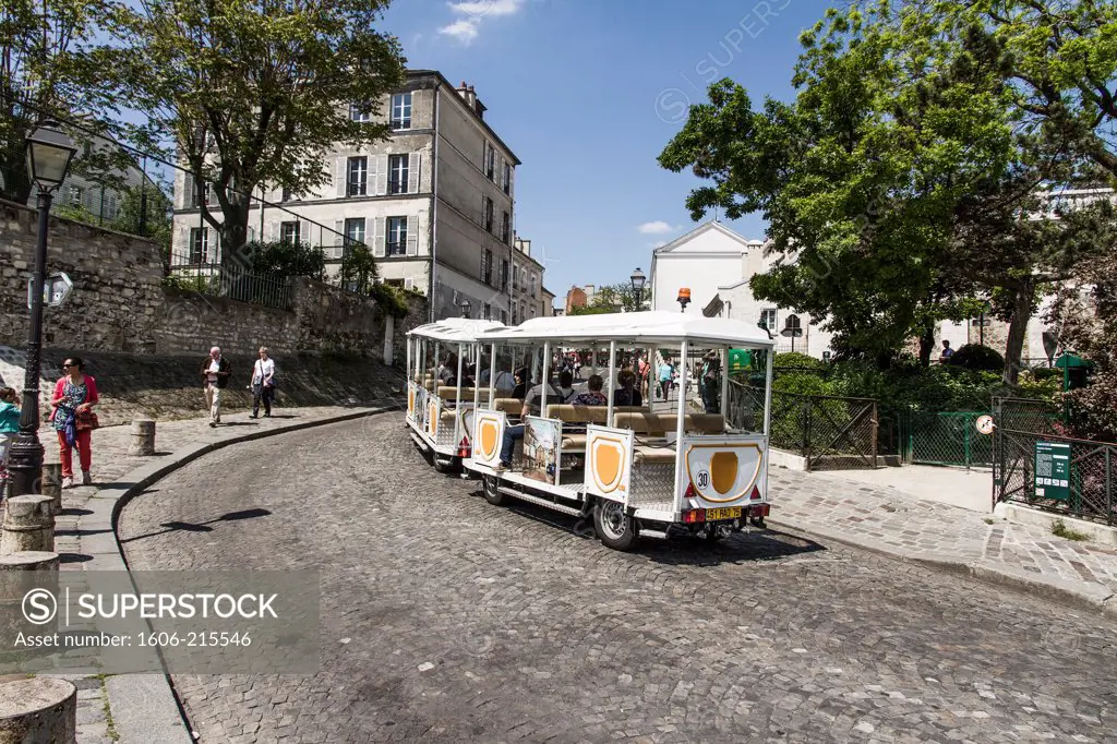 France, Paris, tourist train on Montmartre hill.
