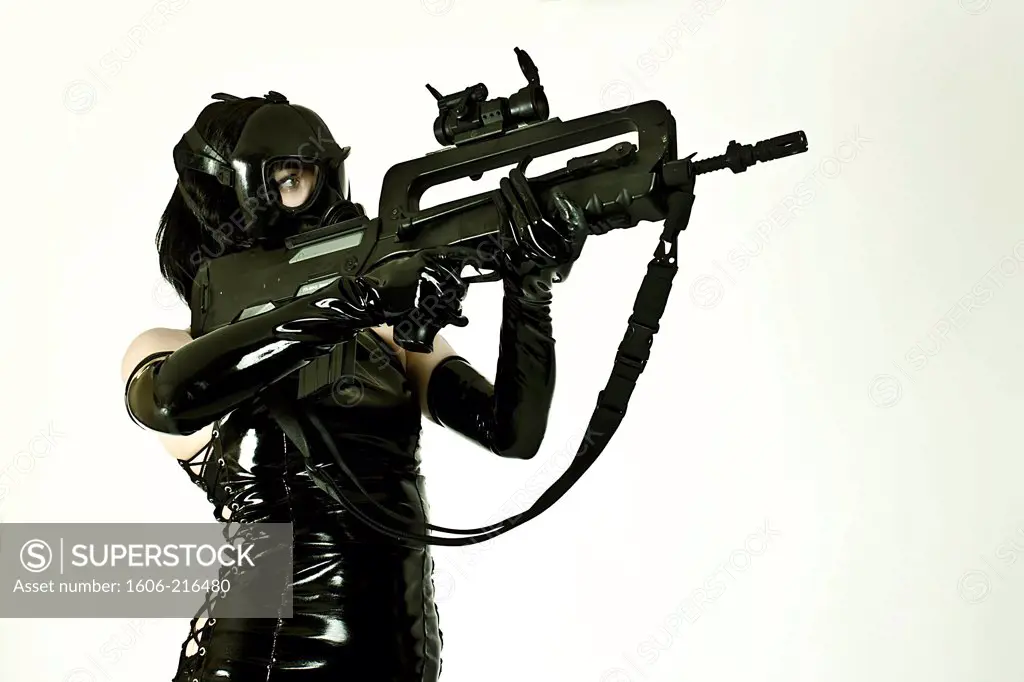Deathworker, a Cyberpunk woman with gas mask and gun  in a studio
