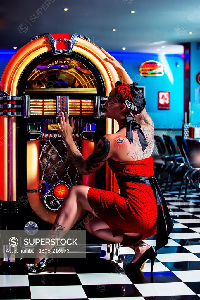 Pin-up listening to music in a diner