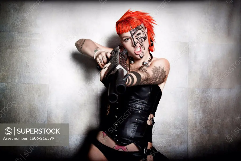 DeathWorker, a Cyberpunk red hair woman with tattoo and gun in a studio