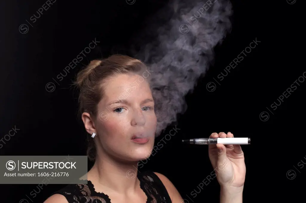 France, young woman smoking an electronic cigarette.