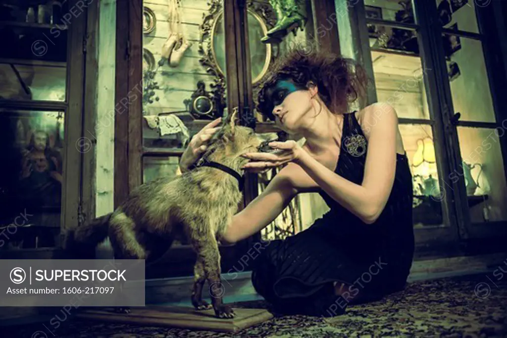 Seated Woman petting a stuffed fox
