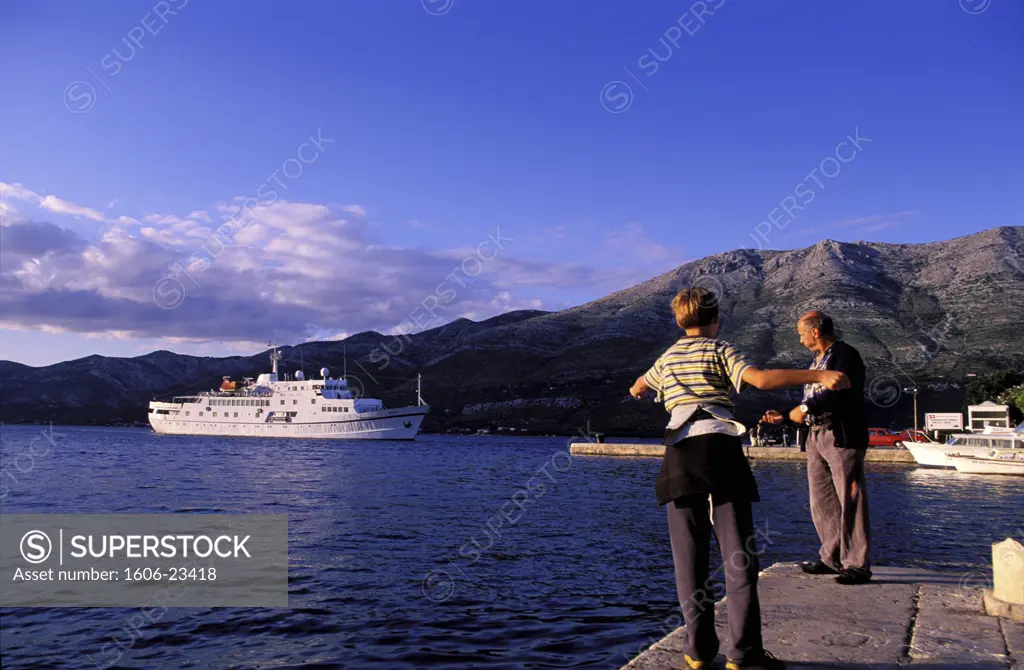 Croatia, Southern Dalmatia, Korcula island, departure of a ferry from the harbour of the medieval city of Korcula