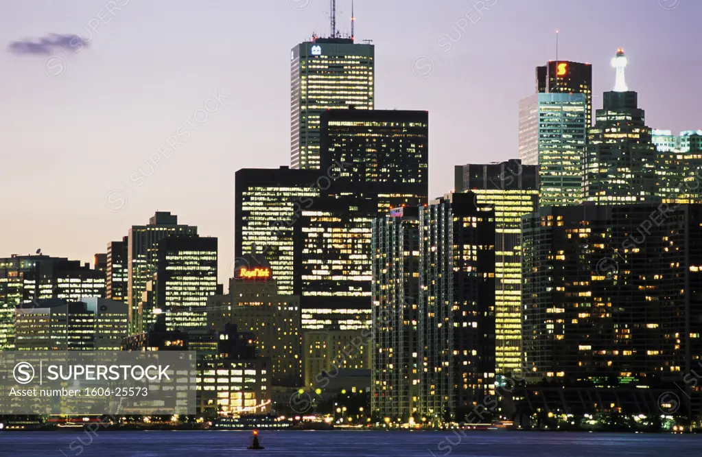 Canada, Ontario, Toronto, skyline at nightfall, lake n the foreground