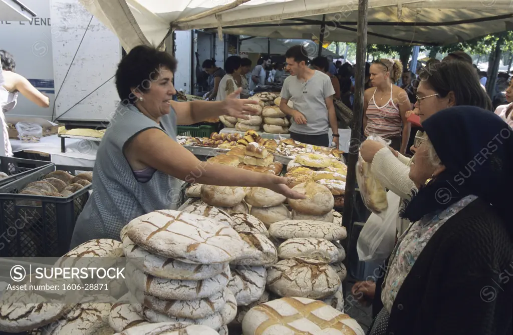 Portugal, Porto, market, woman selling bread, clients
