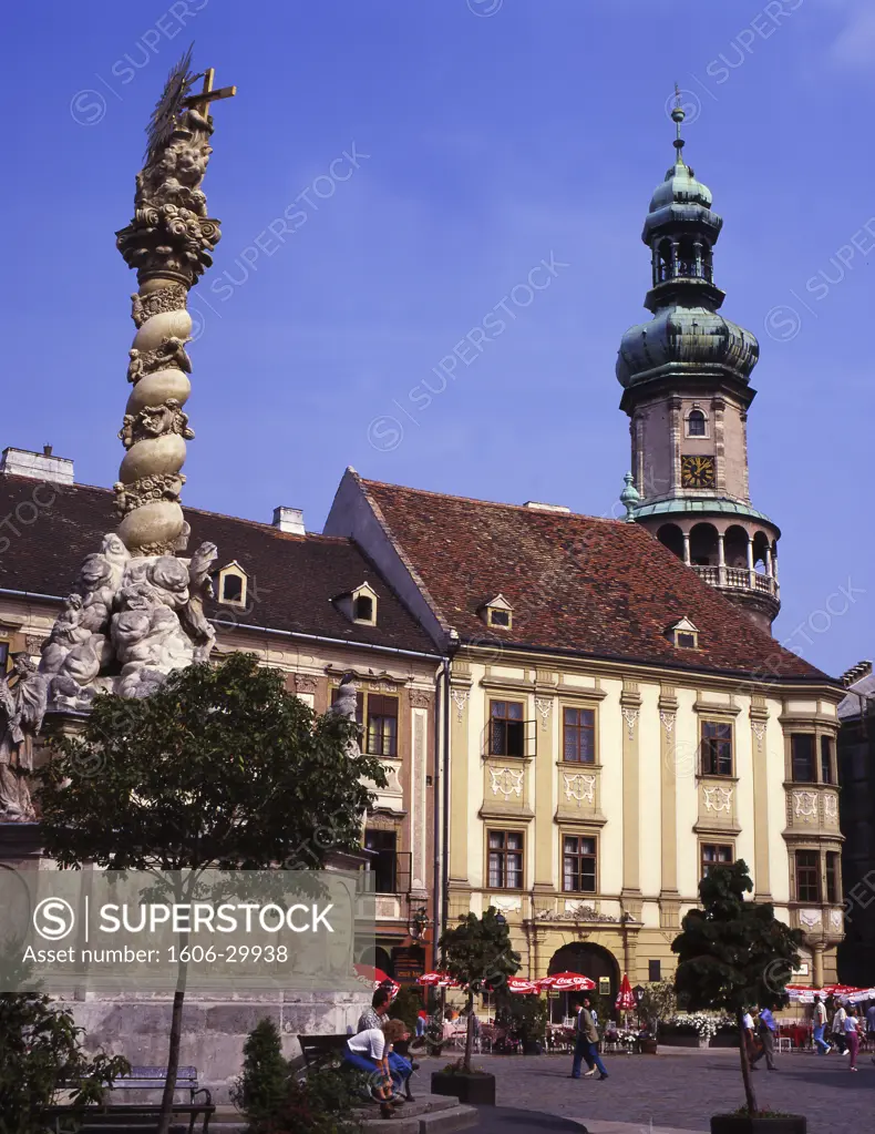 Hungary, Sopron, façades on square, Holy Trinity column, church tower at the back