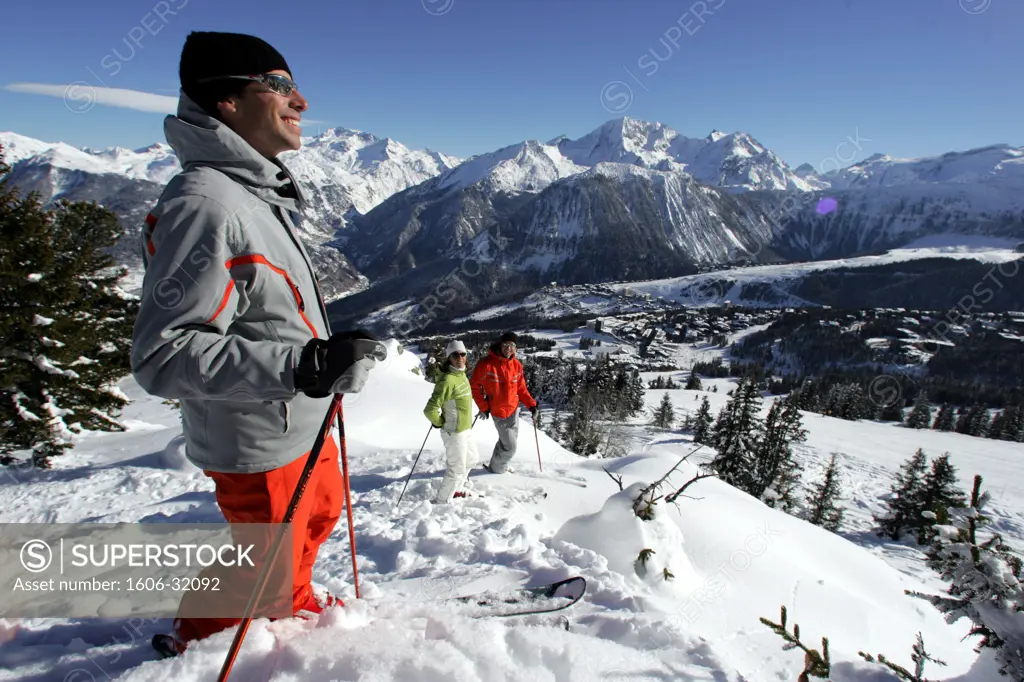 France, Rhône-Alpes, Savoie, Courchevel, man admiring snow-covered moutains