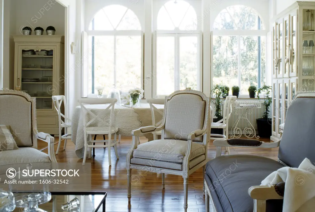 Living interior, armchairs and sofa, wooden floor