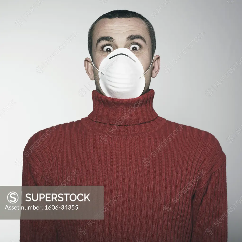 Portrait man, wide-eyed, anti-pollution mask