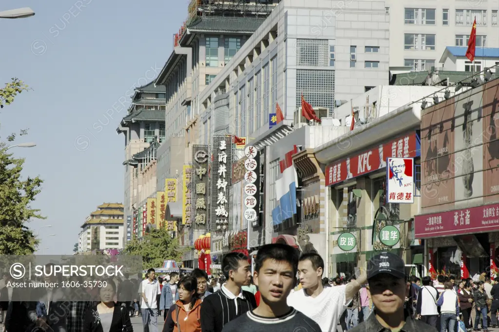 China, Beijing, crowd in Wangfujing street, shop signs
